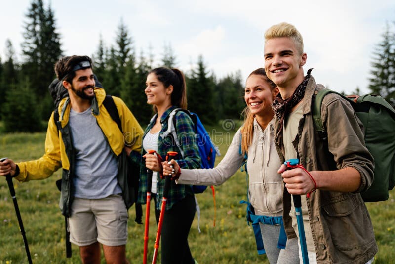 Group of Fit Healthy Friends Trekking in the Mountains Stock Photo ...