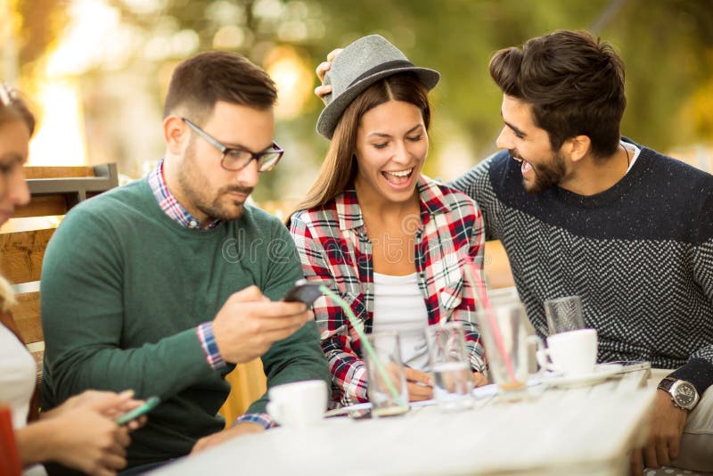 Group of Four Friends Having Fun a Coffee Together. Stock Photo - Image ...