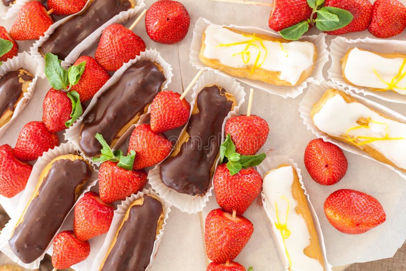 Group of French Dessert Lemon and Chocolate Eclair with Strawberries