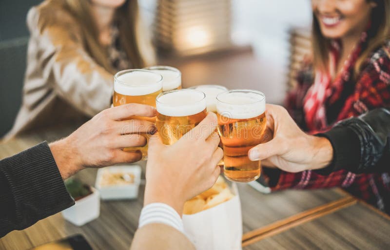 Group of Friends Enjoying a Beer in Brewery Vintage Pub Young People