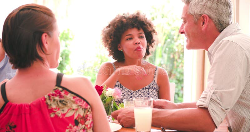 Group Of Friends Enjoying Dinner Party At Home Together