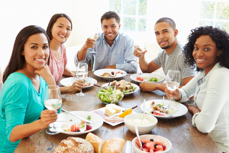 Group of Friends Enjoying Meal at Home Together Stock Photo Image of