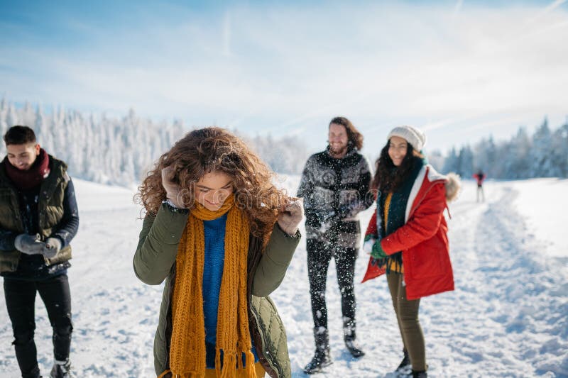 Group of friends enjoying winter time in snowy nature. royalty free stock photography