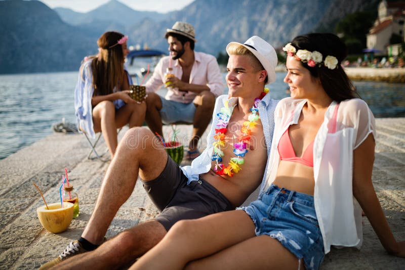 Group of friends having fun and dancing on the beach. Summer party on the beach royalty free stock photography Group of friends having fun and dancing on the beach. Summer party on the beach royalty free stock photography
