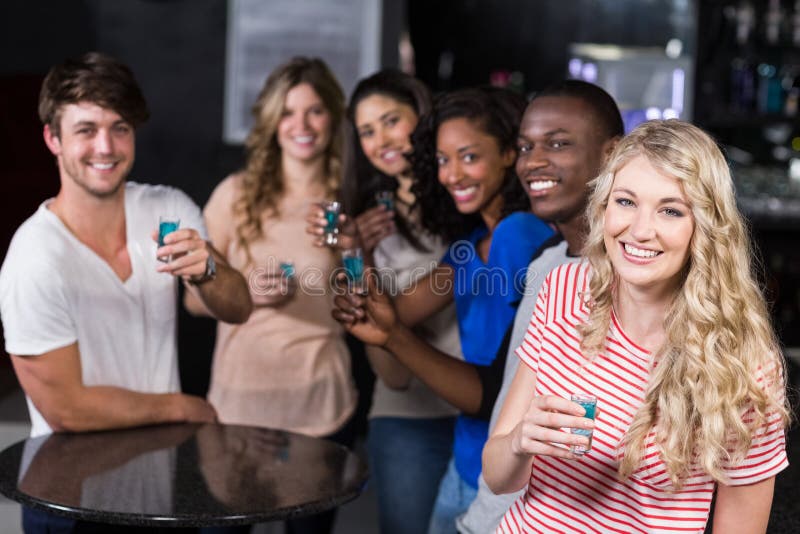 Group of friends having shots royalty free stock photo