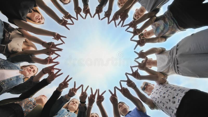 A group of friends make a circle out of their fingers. The concept of unity. stock image A group of friends make a circle out of their fingers. The concept of unity. stock image