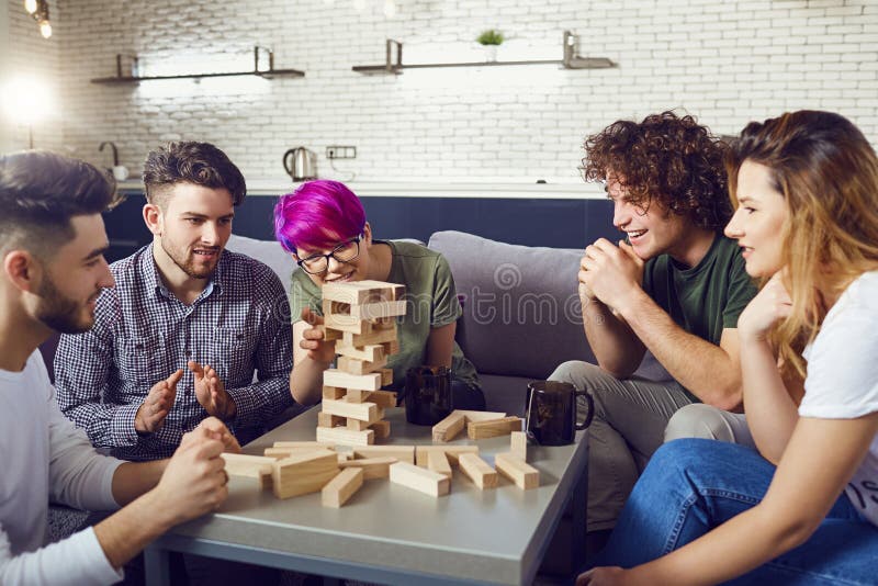 A Cheerful Group of Friends Play Board Games. Stock Photo Image of
