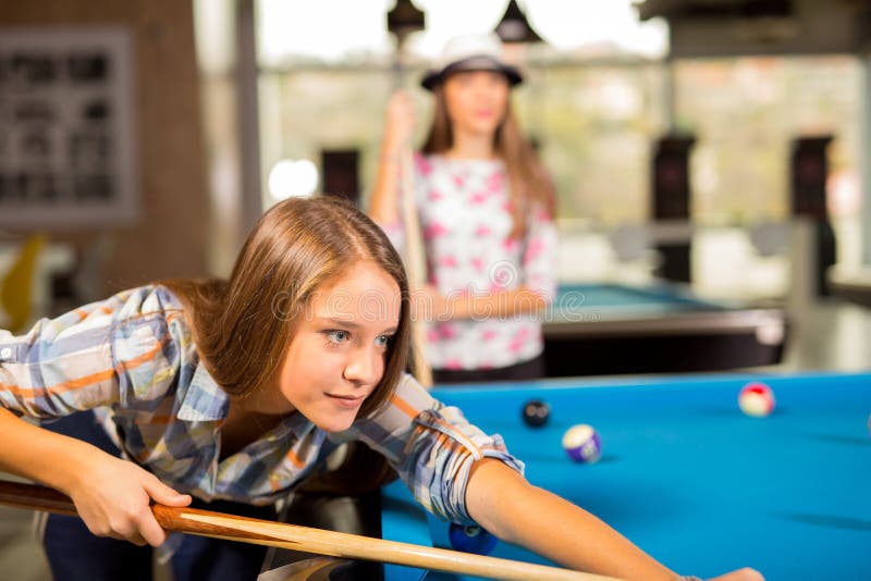 Group of Friends Playing Pool Together. Stock Photo Image of number