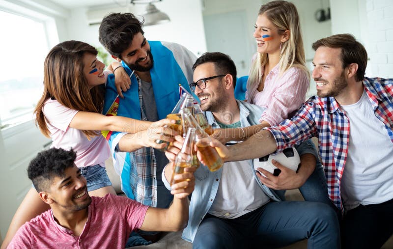 Group Of Friends Sport Fans Watching Soccer Match Toast