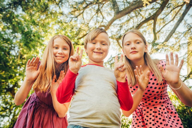 Group of 3 Funny Kids Playing Together Outside Stock Image - Image of park, group: 124380831 Group of 3 Funny Kids Playing Together Outside Stock Image - Image of park, group: 124380831