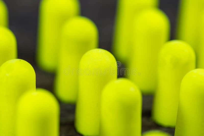 Group of green colorful earplugs close up macro shot royalty free stock photo
