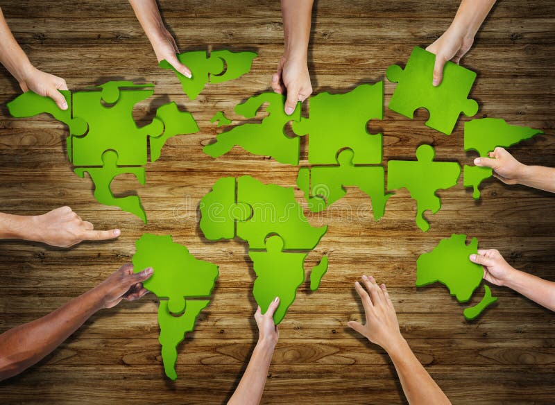 Group of Hands Holding Jigsaw Puzzle Forming World