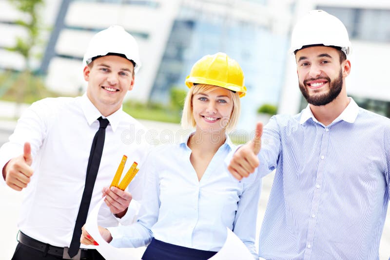 Group of happy architects on site royalty free stock photography