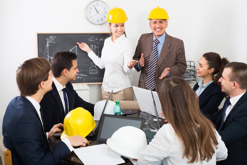 Group of Happy Engineers Discussing Project Stock Photo Image of