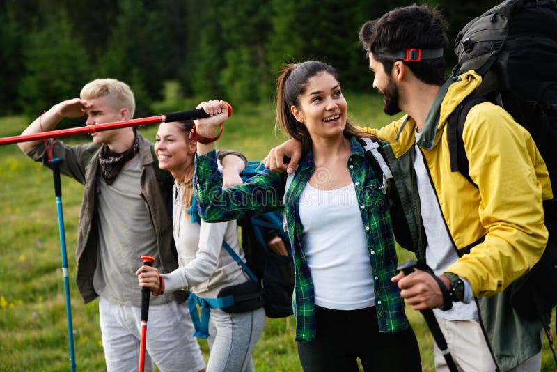 Group of Happy Friends with Backpacks Hiking Together Stock Photo ...