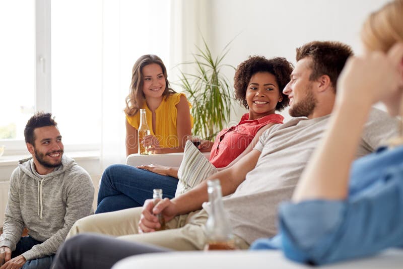 Group Of Happy Friends With Drinks Talking At Home Stock Image Image