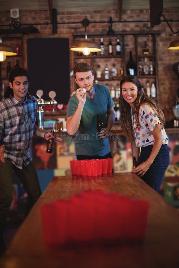 Group of Happy Friends Playing Beer Pong Game Stock Photo Image of