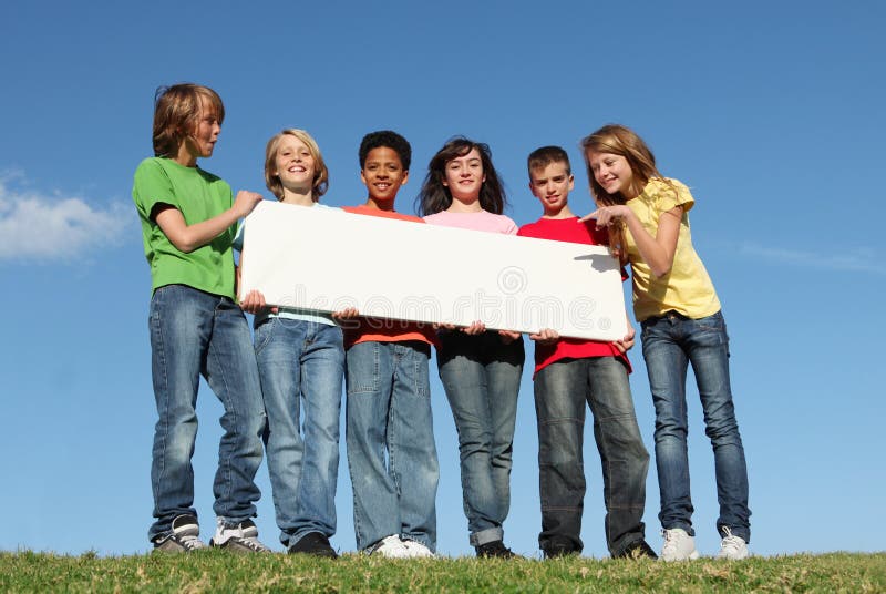 Group of happy kids,blank sign royalty free stock photography