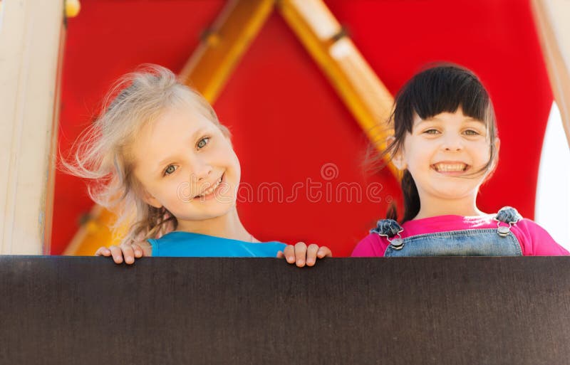 Group of happy little girls on children playground