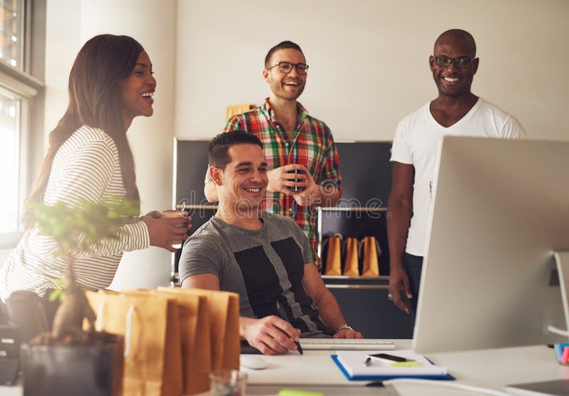 Group of happy young adults at small business royalty free stock photography