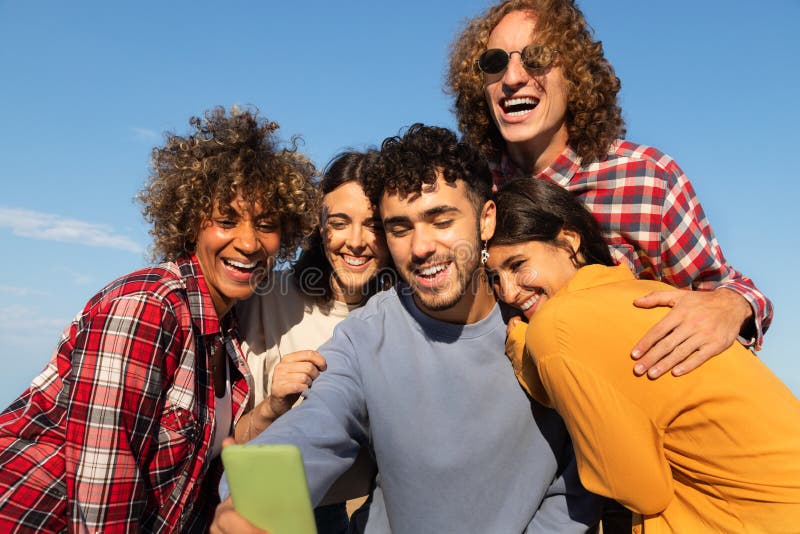 Group Of Happy Young Multiracial Friends Having Fun Take Selfie 