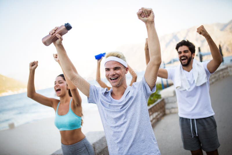 Group of young people friends running outdoors at seaside royalty free stock images Group of young people friends running outdoors at seaside royalty free stock images