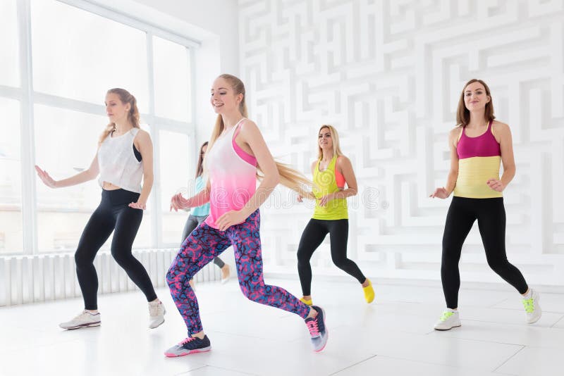 Young Women Practicing Balance Acro Yoga Foto stock 790940962