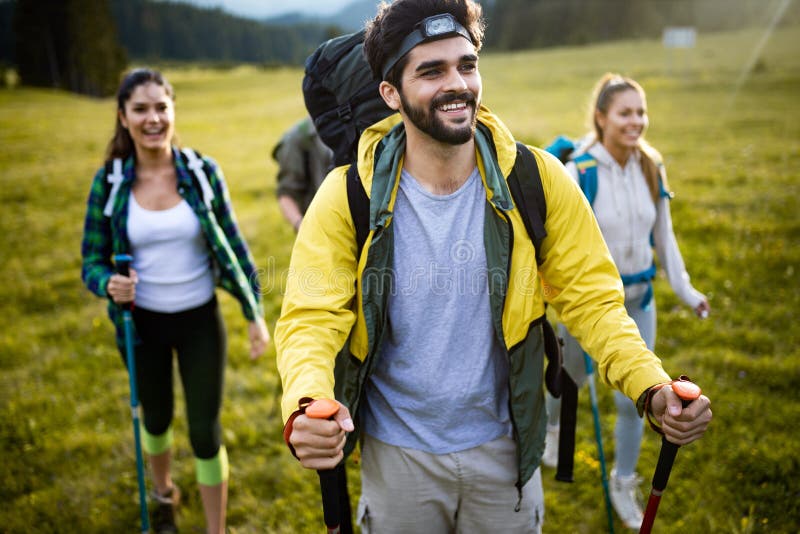 Group of Hikers Walking on a Mountain and Smiling Stock Image - Image ...