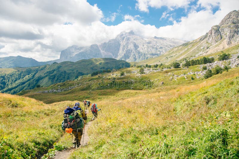 Group Hiking in the Mountains with Large Backpacks. Russia Stock Image