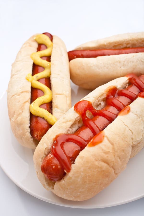 Three Hot Dogs on a Plate with Drinks Stock Image Image of mustard