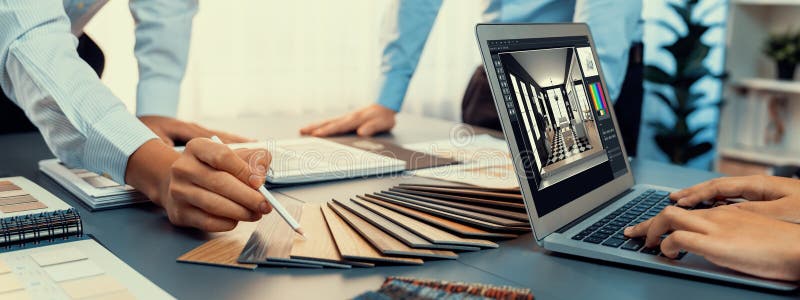 Group of interior architect at table choosing material selection. Insight royalty free stock image