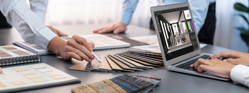Group of interior architect at table choosing material selection. Insight royalty free stock photo