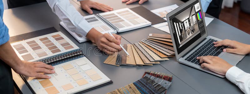 Group of interior architect at table choosing material selection. Insight stock image
