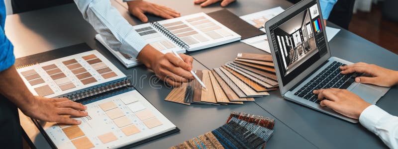 Group of interior architect at table choosing material selection. Insight royalty free stock photo