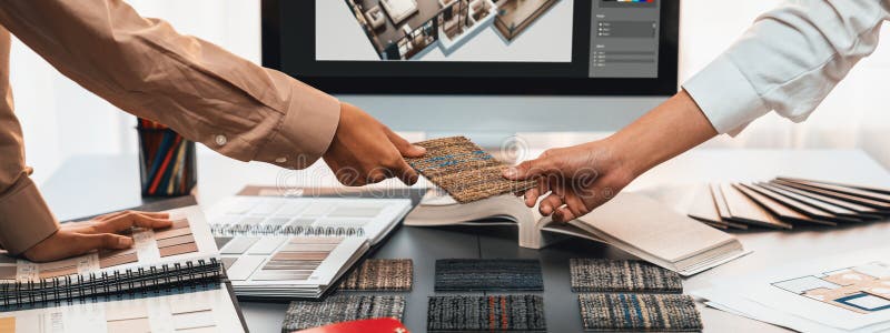 Group of interior architect at table choosing material selection. Insight stock photos