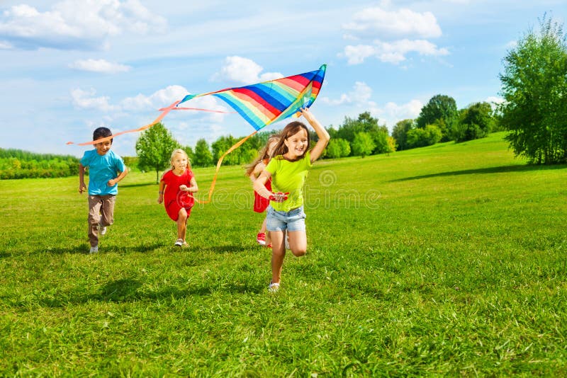 Group of kids with kite royalty free stock image