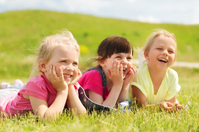 Group of Kids Lying on Blanket or Cover Outdoors Stock Image - Image of ...