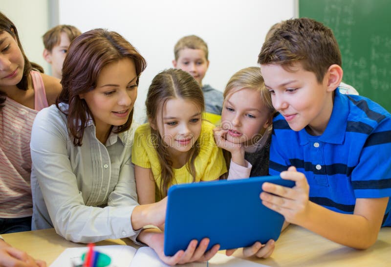 Group of kids with teacher and tablet pc at school