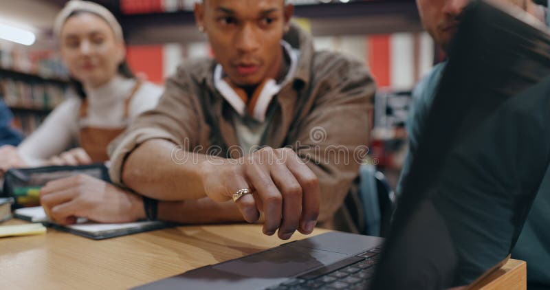 Group, laptop and studying for exam, library and browsing of web, education and friends with technology. College royalty free stock photo