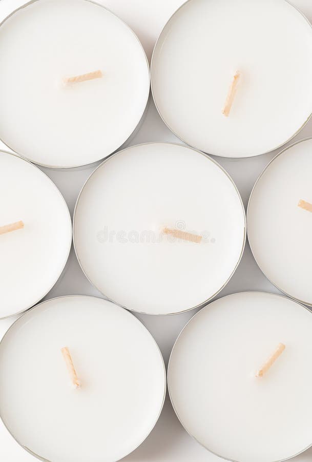 https://thumbs.dreamstime.com/b/group-large-tealights-long-burning-candles-above-also-known-as-nightlights-tea-lites-t-thin-metal-cups-288771510.jpg