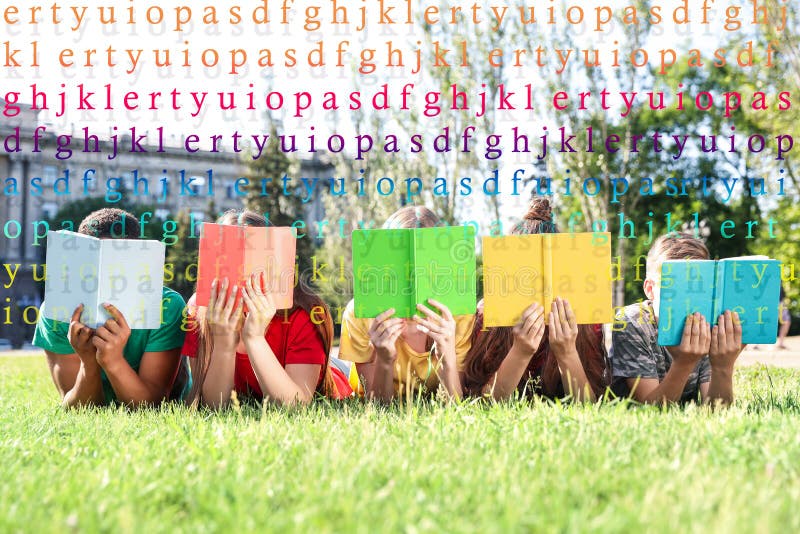 Group of little children reading books on grass in park royalty free stock photography Group of little children reading books on grass in park royalty free stock photography