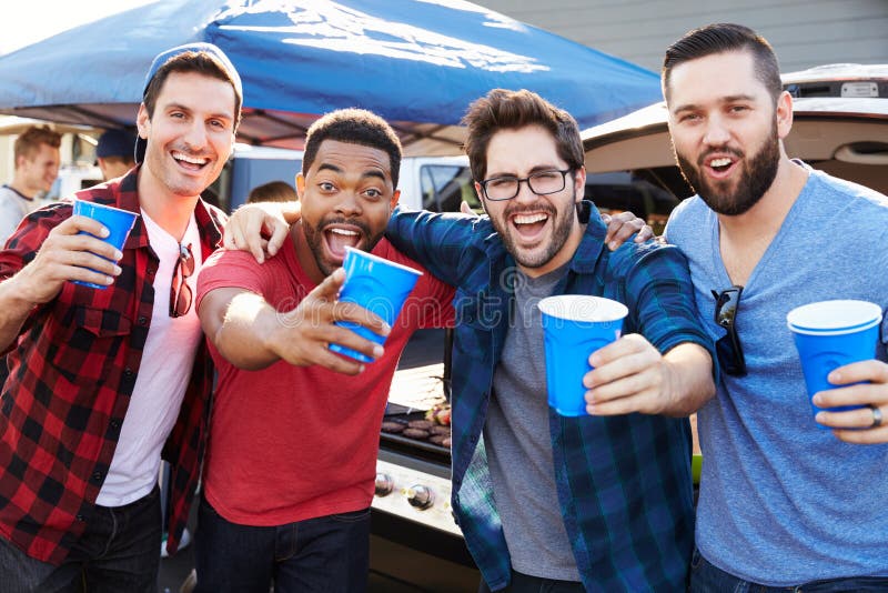 Group Of Male Sports Fans Tailgating In Stadium Car Park royalty free stock photos Group Of Male Sports Fans Tailgating In Stadium Car Park royalty free stock photos