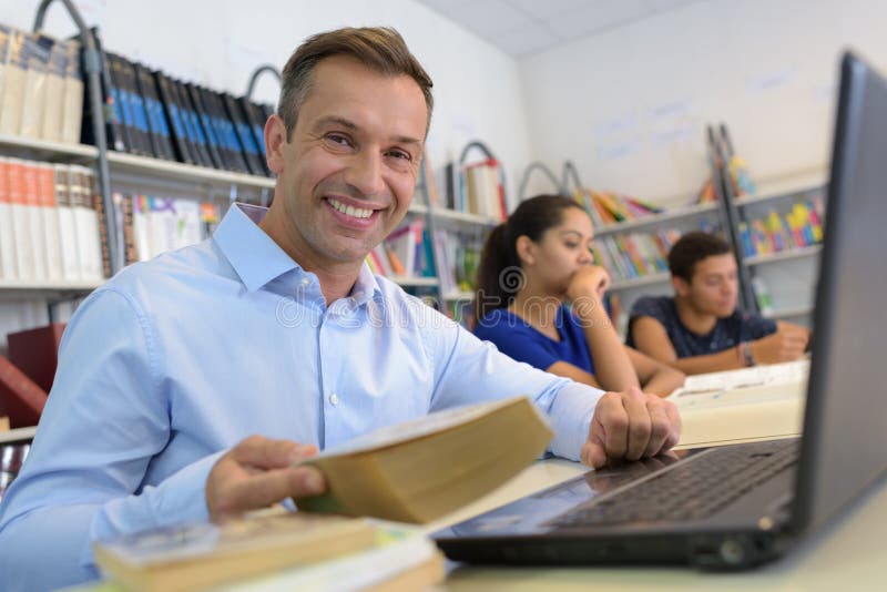 Group mature students studying in library stock image