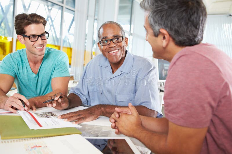 Group Of Men Meeting In Creative Office Talking