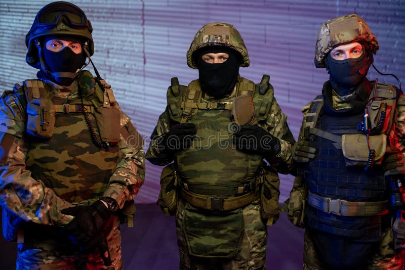Group of men in protective military outfit stock image
