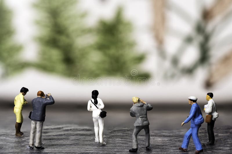 A Group of Miniature Photographers taking pictures of a Muriel stock photography A Group of Miniature Photographers taking pictures of a Muriel stock photography