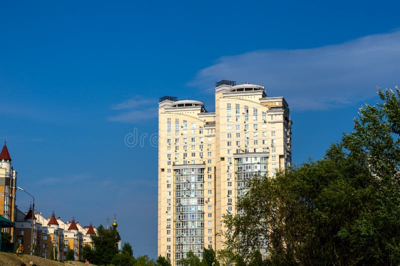 Kiev, Ukraine - July 20, 2015: Group of modern multi-storey yellow and white big houses on background of blue sky