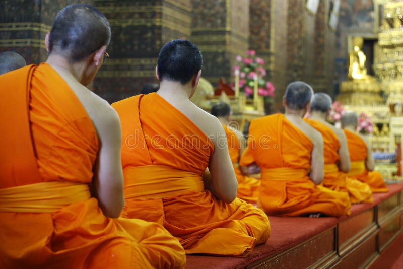 Group of monk praying in buddhist temple stock photography