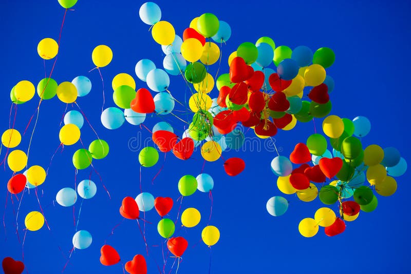 Group of Multicolored Helium Filled Balloons in the Sky Stock Image