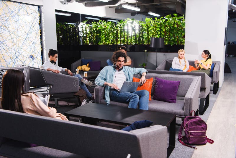 group of multicultural business people working and talking at modern coworking royalty free stock images group of multicultural business people working and talking at modern coworking royalty free stock images